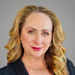 Headshot of Susanna Burgess, smiling professionally.